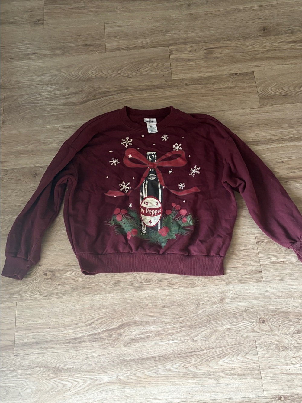 Women's oversized Crewneck Holiday Sweater in Maroon with Festive Bottle Graphic